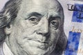 Benjamin Franklin face on us one hundred dollar bill macro isolated, united states money closeup Royalty Free Stock Photo