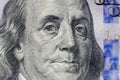 Benjamin Franklin face on us one hundred dollar bill macro isolated, united states money closeup Royalty Free Stock Photo