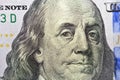 Benjamin Franklin portrait on the banknote of 100 dollars, one hundred American dollars background, selective focus