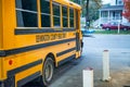 BENNINGTON, NH - OCTOBER 2015: Yellow schoolbus parked along a city street Royalty Free Stock Photo