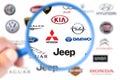 Collection of logos printed on white paper of the most important car manufacturers in the world