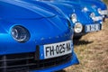 blue new and old Renault Alpine A110,car exhibited at the tour de france in small village