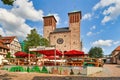 Bensheim, Germany - Saint George`s Parish Church with temporary pop-up restaurant in old historic city center on sunny summer day