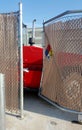 Bent and broken gate to a warehouse yard. Royalty Free Stock Photo