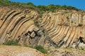 Bent hexagonal columns of volcanic origin at the Hong Kong Global Geopark in Hong Kong, China.