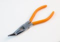 Bent long nose pliers on white background Royalty Free Stock Photo