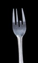 Bent metal fork, one teeth down. Royalty Free Stock Photo