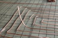 Bent new copper pipes laying on concrete floor
