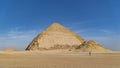 The Bent Pyramid is an ancient Egyptian pyramid located at the royal necropolis of Dahshur, approximately 40 kilometres south of