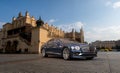 Bentley Flying Spur on the background of chistoric architecture