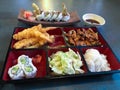 Bento box with teriyaki chicken rice california sushi roll