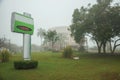 Placard on a garden in a foggy day