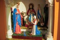 Statuettes of Virgin Mary and saints in a shrine