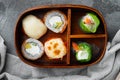 Bento Lunch Sushi roll, on gray stone background, top view flat lay