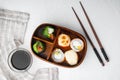 Bento Lunch Sushi roll, on white stone background, top view flat lay