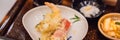 Bento set of prawn tempura and chicken teriyaki in japanese restaurant BANNER, LONG FORMAT Royalty Free Stock Photo