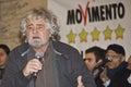 Beppe Grillo,amazed, surprised,angry,screaming,on stage,