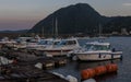 Beppu Harbor with Boats and Mountain in the Background in the evening. Beppu, Oita Prefecture, Japan, Asia