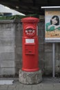 Traditional red Japanese post box along the street