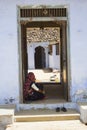 BERA, RAJASTHAN, INDIA April 2014 Traditional women sitting at door of house Royalty Free Stock Photo