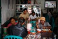 a group of Indonesian friends eat at a local eatery