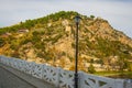 BERAT, ALBANIA: Stone bridge over Osum river at Berat. Castle of Berat and orthodox church of Holy Trini. Royalty Free Stock Photo