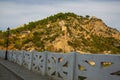 BERAT, ALBANIA: Stone bridge over Osum river at Berat. Castle of Berat and orthodox church of Holy Trini. Royalty Free Stock Photo