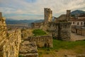 BERAT, ALBANIA: The strong upper corner tower of ancient Berat castle with walls, arches and stairways.