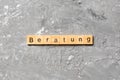 Beratung word written on wood block. Beratung text on cement table for your desing, concept