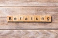 Beratung word written on wood block. Beratung text on wooden table for your desing, concept