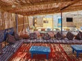 Berber chill out. Relaxation and Arabic culture. Bedouin tent with fluffy pillows and colorful rugs in the Sinai desert