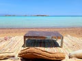 Berber chill out with rug, cushions and old table on the beach with turquoise waters of the Sinai Peninsula. Beach bars and Arab Royalty Free Stock Photo