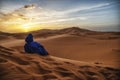 Berber man at sunset in the Sahara desert of Merzouga, Morocco Royalty Free Stock Photo