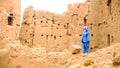 Berber man wearing blue drees and turban in a village, Morocco