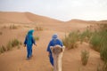 Berber men with camel Royalty Free Stock Photo