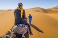 Berber nomad and a girl on camel in Sahara desert