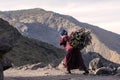 Berber woman carrying fire wood on his back in High Atlas mountains, Morocco