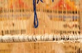 Berber woman weaving a carpet in medina souke in Marrakesh Royalty Free Stock Photo