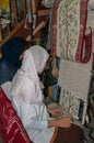 Handcrafting carpets in Tunisia by berber women