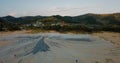 Flying backwards over mud volcanoes and lunar looking landscape