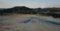 Flying forwards over mud volcanoes and lunar looking landscape