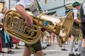 Festival with parade of fanfare and people in traditonal costumes