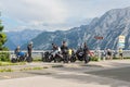 Motorcyclists at car park Rossfeld panorama road over German mountains