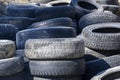 BERDSK, RUSSIA - APRIL 30, 2022: A bunch of old used worn out tires