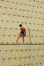 Berdyansk/Ukraine - JUNE 22, 2019: A rock climber man trains at the climbing wall. Active and healthy lifestyle.