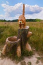 Berendeyevo, Russia, Moscow region, July 26, 2014, summer landscape with fabulous sculptures. Funny ginger cat on the