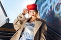 Beautiful young photo model wearing red beret and accessories