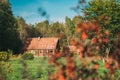 Berezinsky, Biosphere Reserve, Belarus. Traditional Belarusian Tourist Guest Houses In Early Autumn Landscape. Popular Royalty Free Stock Photo