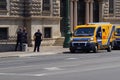 Security guards and armed vans in front of the entrance of The Bank of Italy