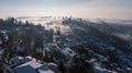 Bergamo, Italy. Drone aerial view of an amazing landscape of the fog rises from the plains and covers the old town Royalty Free Stock Photo